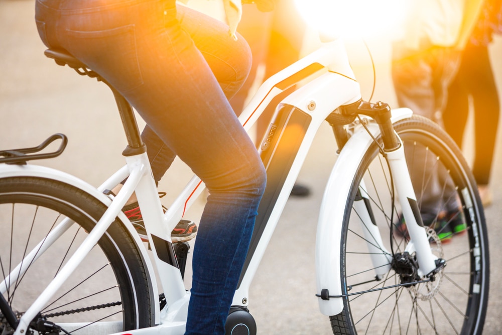 A woman riding an e-bike, which has become incredibly popular in Connecticut